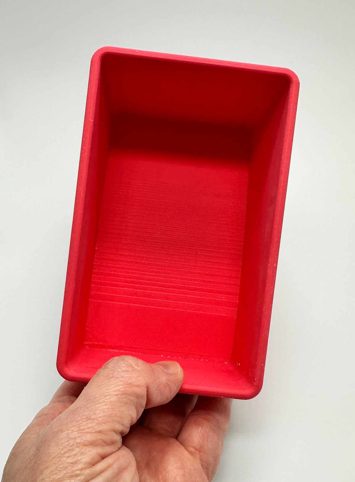 Bird treat dish for curved top cage